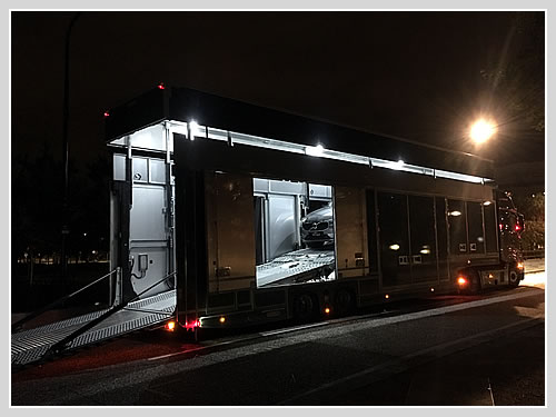 Covered car transport to a track day in Spain.